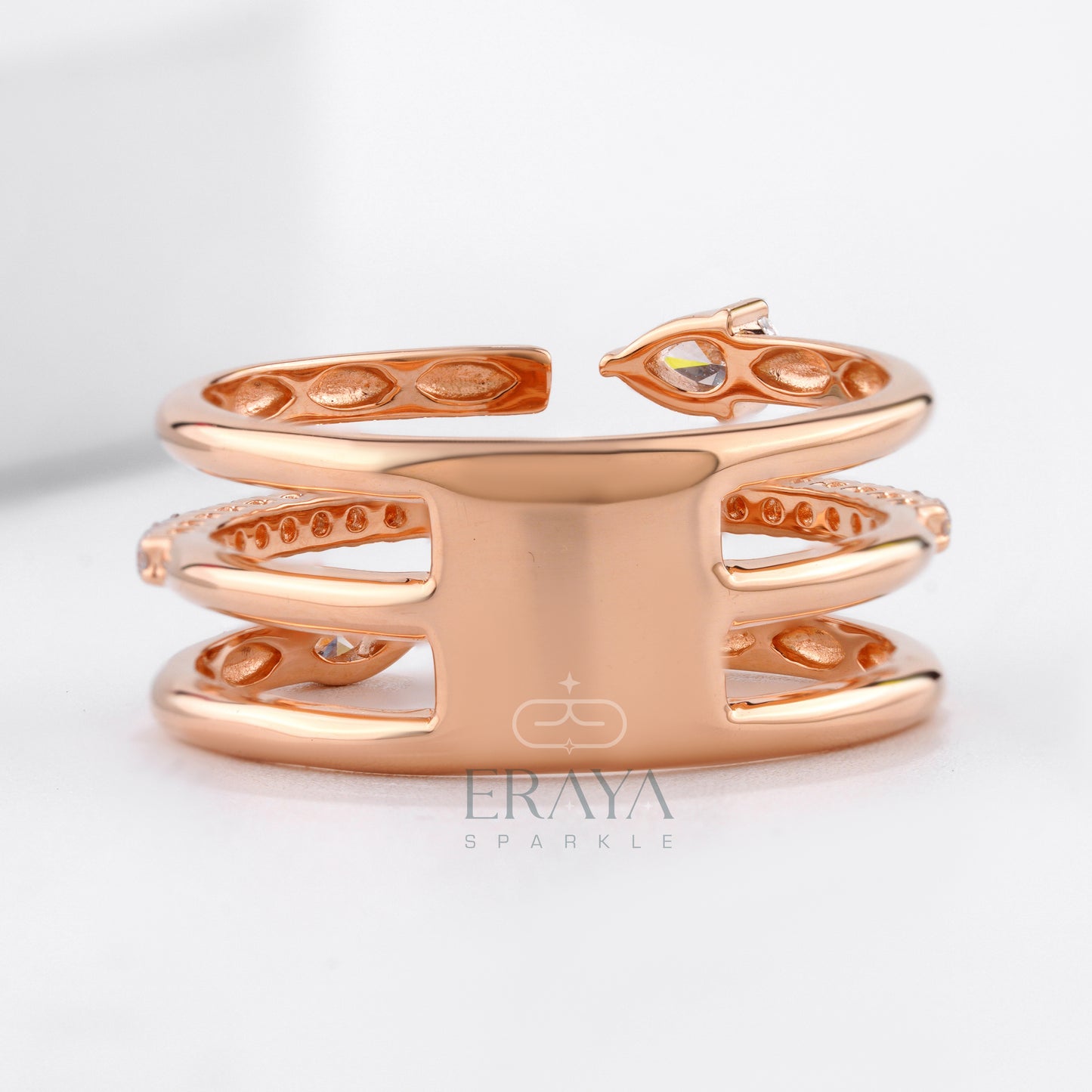 Rose gold bracelet with intricate designs on a light gray background, featuring the brand 'Eraya'.