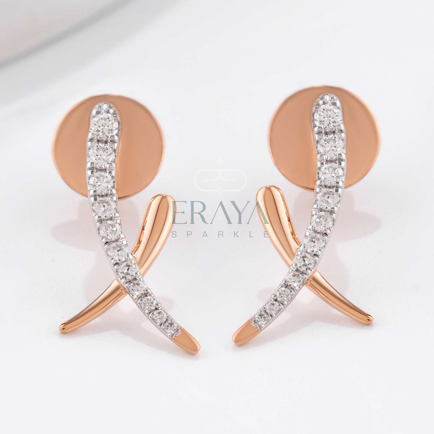 Rose gold earrings with clear gemstones on a light background, featuring the brand 'Eraya Sparkle'.