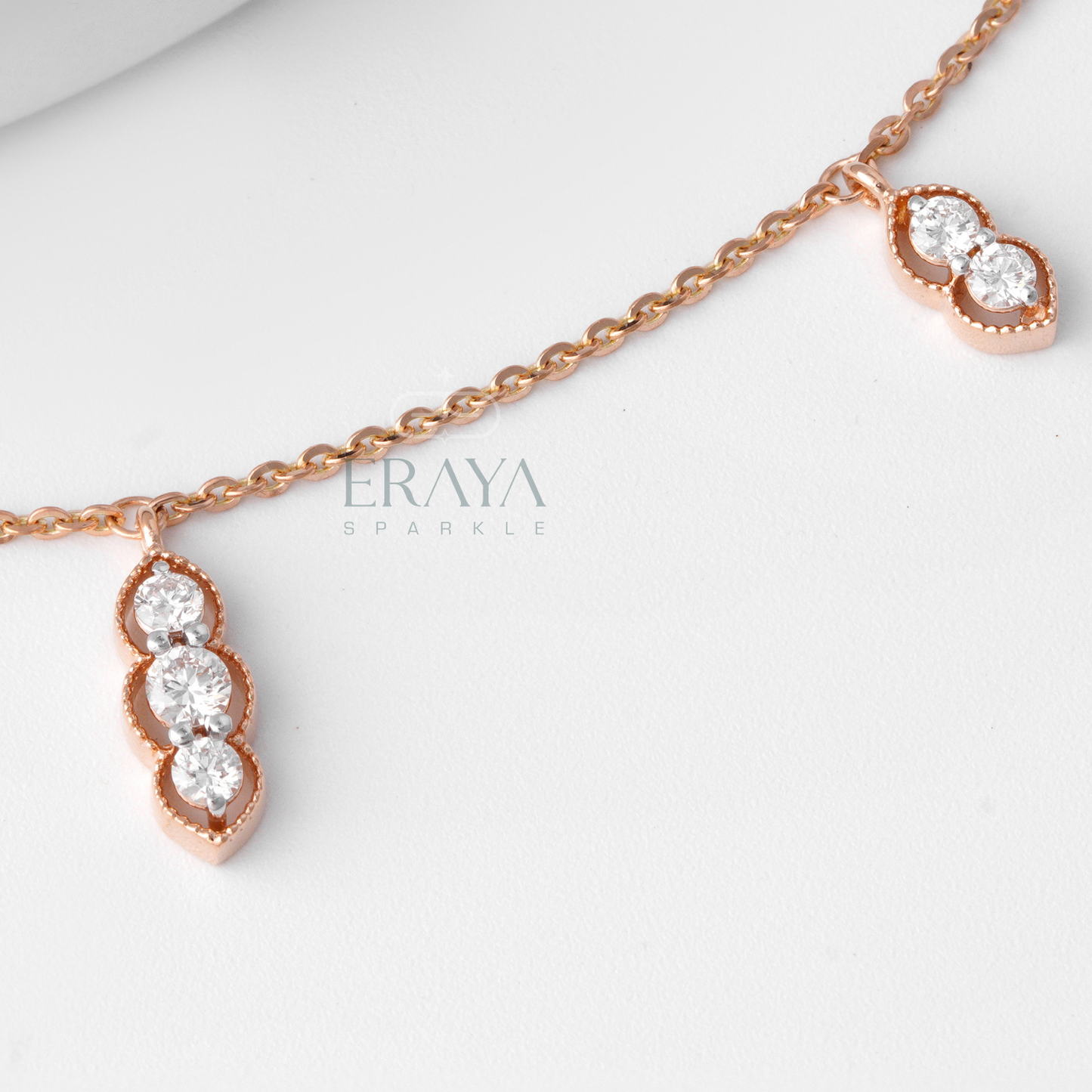 Rose gold diamond s necklace with triple diamond drop design