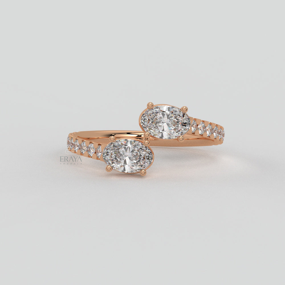 Rose gold diamond ring on a light gray background