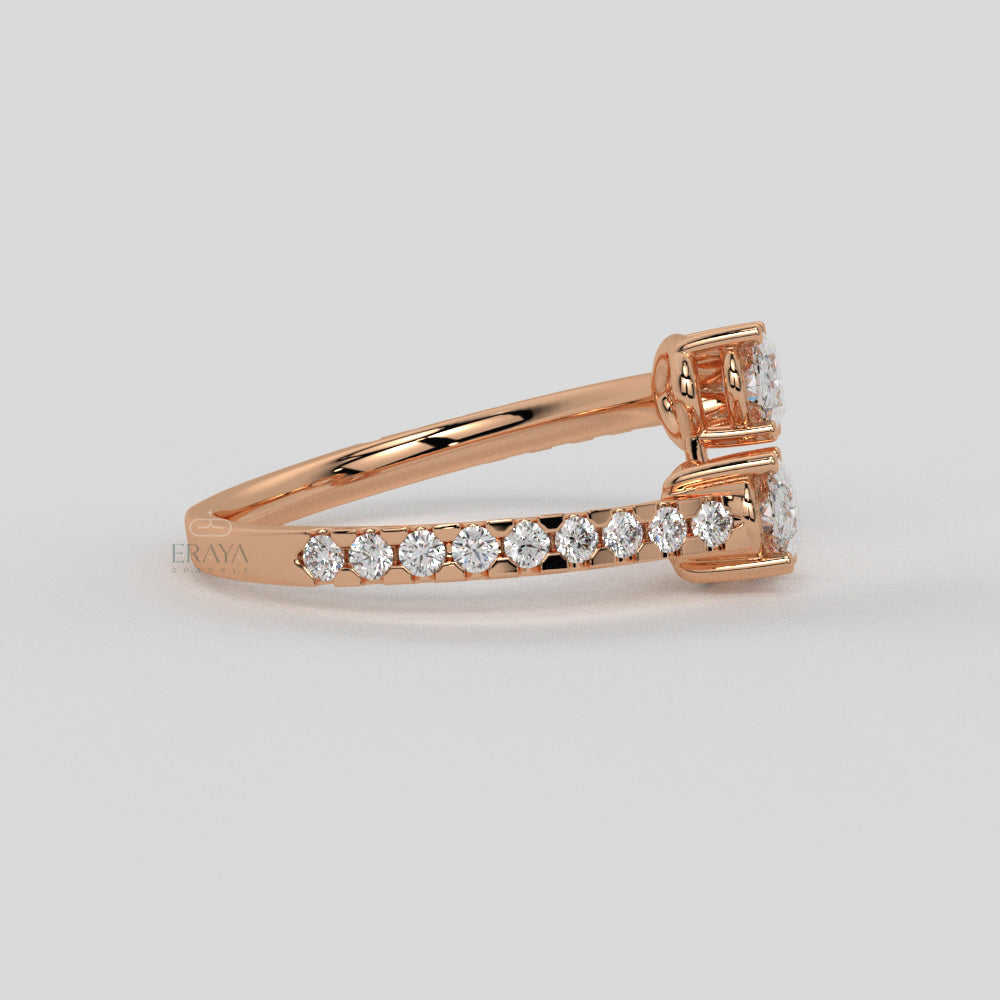 Rose gold ring with diamonds on a light gray background