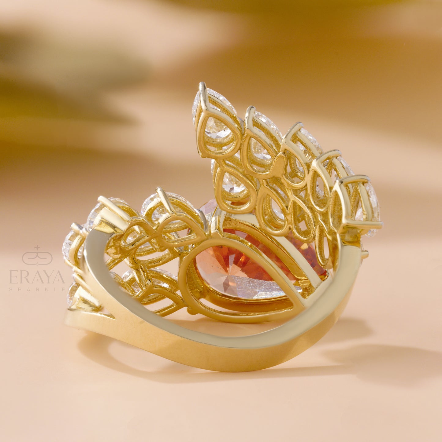 Solid gold bypass ring with pear-cut stones