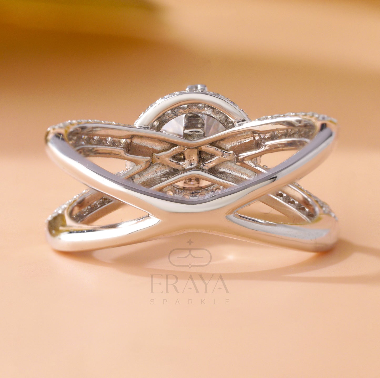 Close-up of round solitaire with split shank pavé diamonds