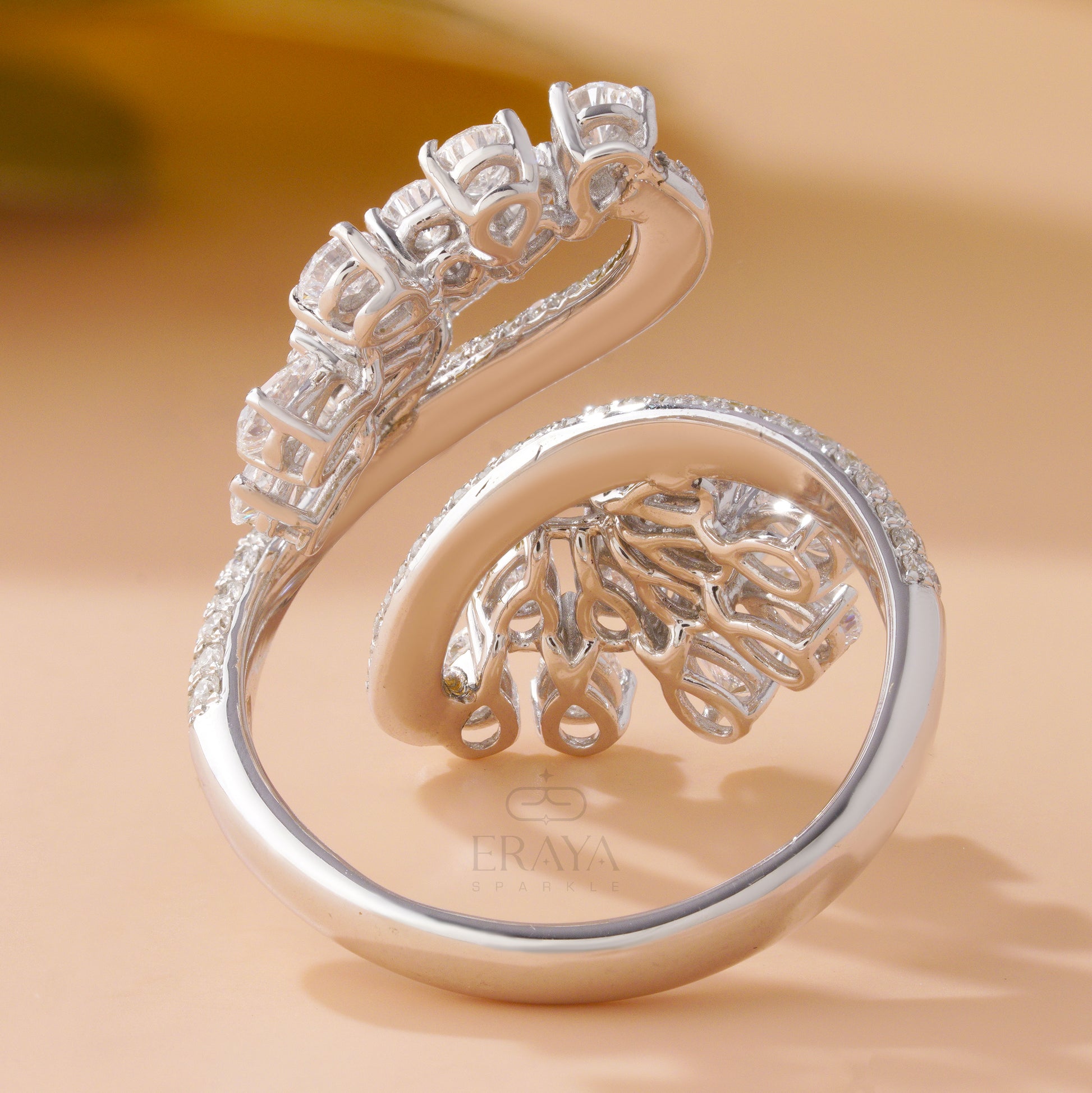 Pear cut diamond cocktail ring with pavé band