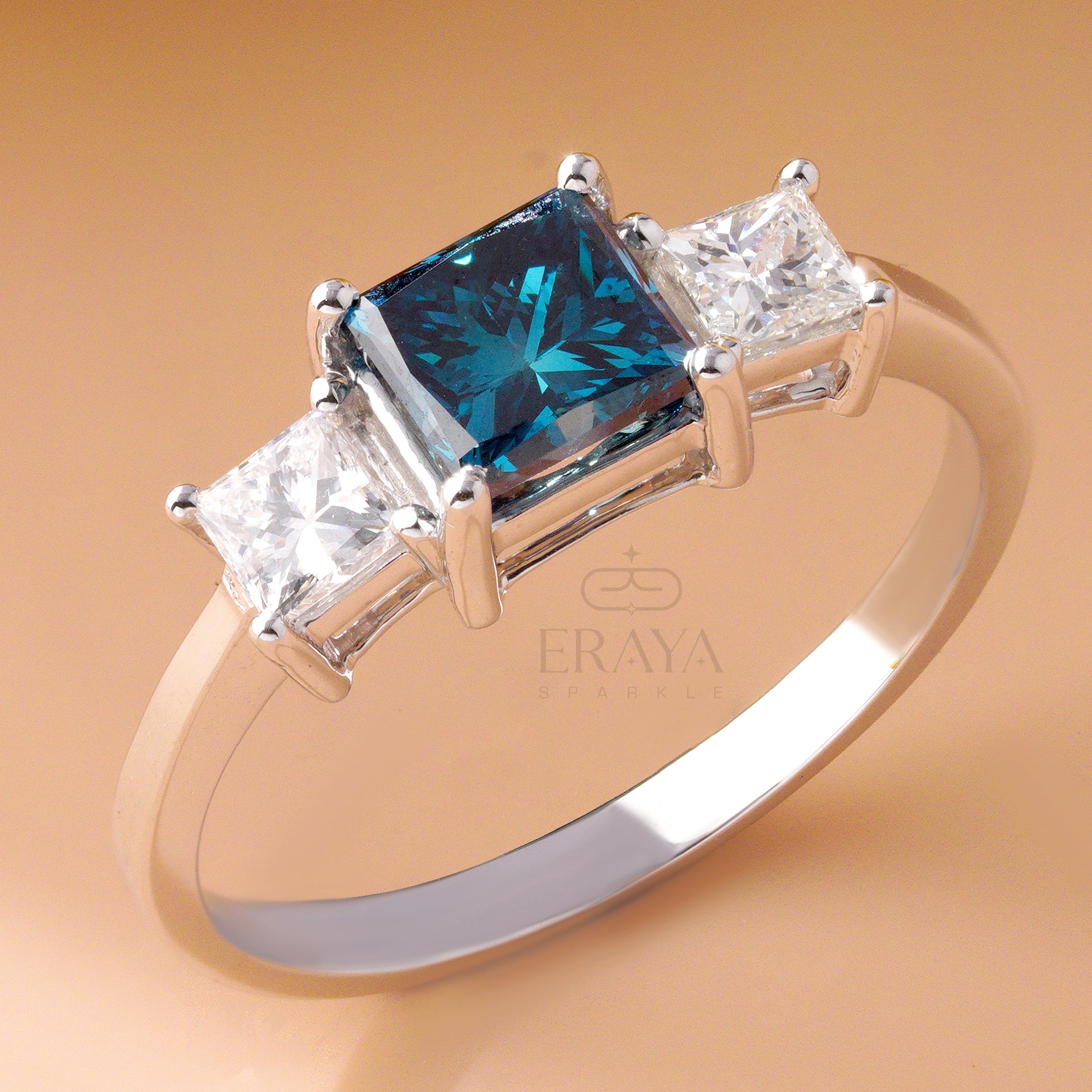 White gold promise ring with blue center stone