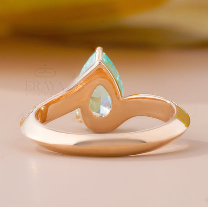 Gold ring with a turquoise stone on a beige background