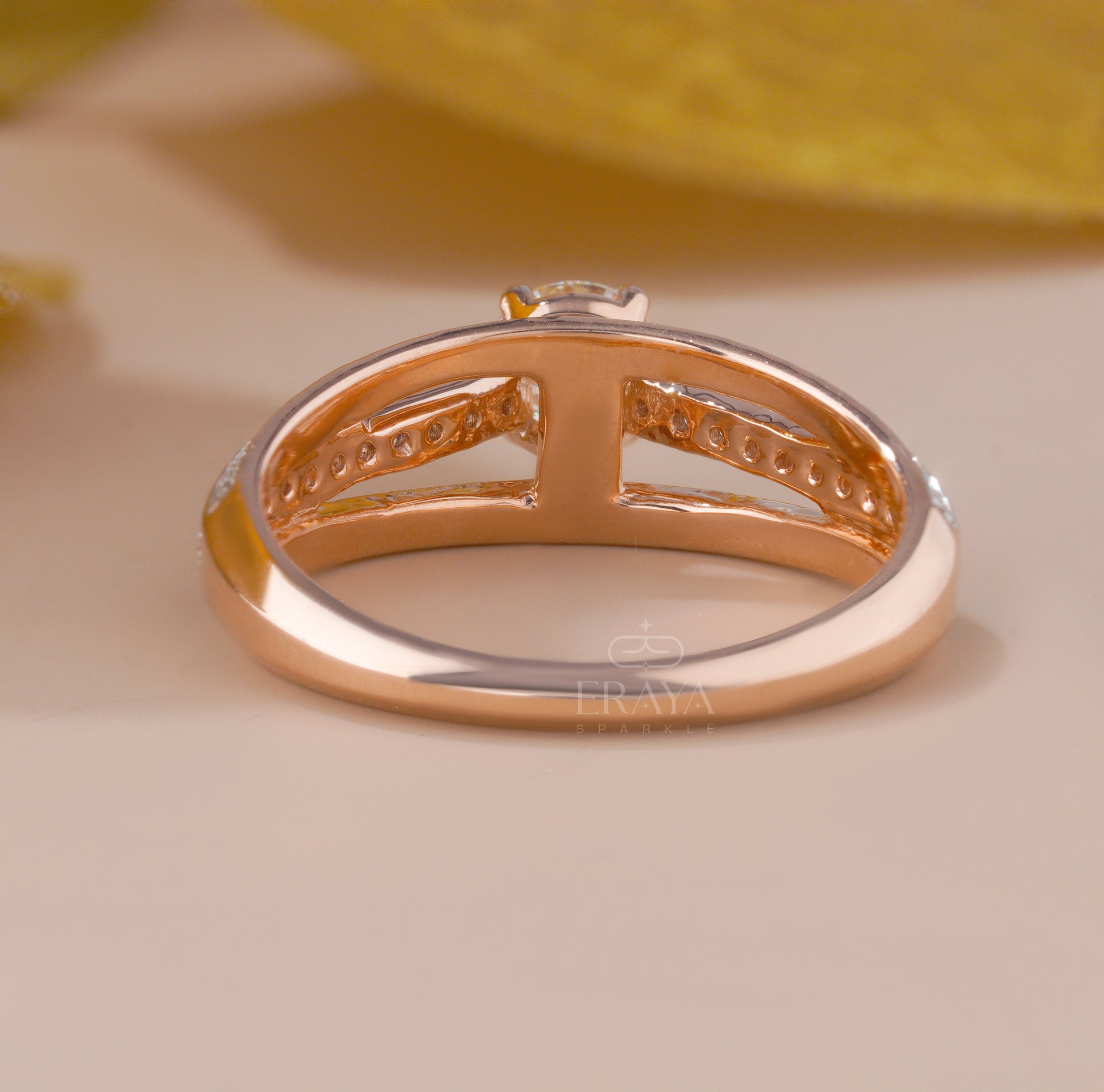 Ethical rose gold engagement ring with pavé accent diamonds