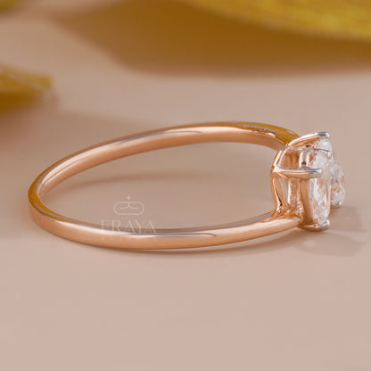 Rose gold ring with a diamond on a beige background
