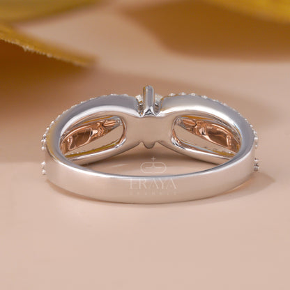 Silver ring with rose gold accents on a beige background