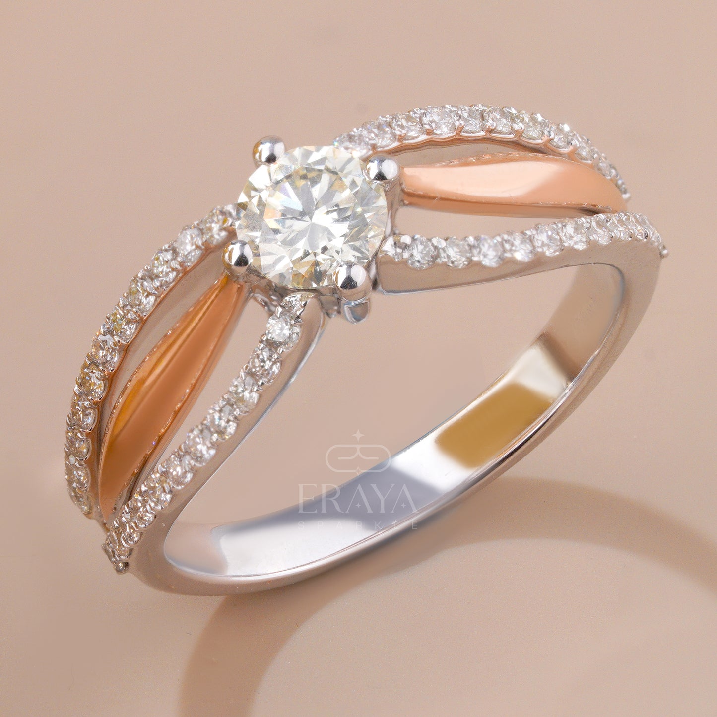 Rose gold and silver ring with diamonds on a beige background