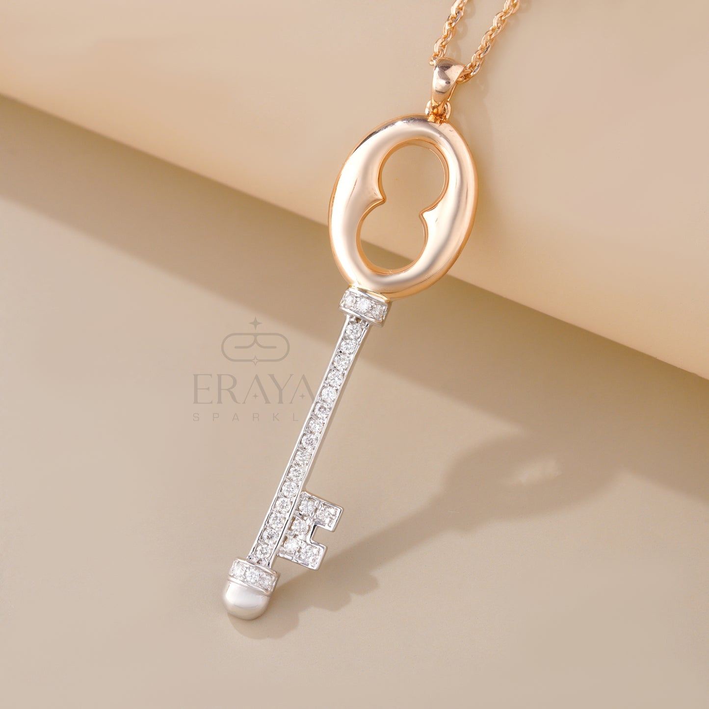 Close-up of pavé diamond key necklace in rose and white gold – IGI GIA certified