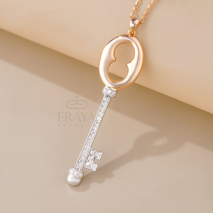 Close-up of pavé diamond key necklace in rose and white gold – IGI GIA certified
