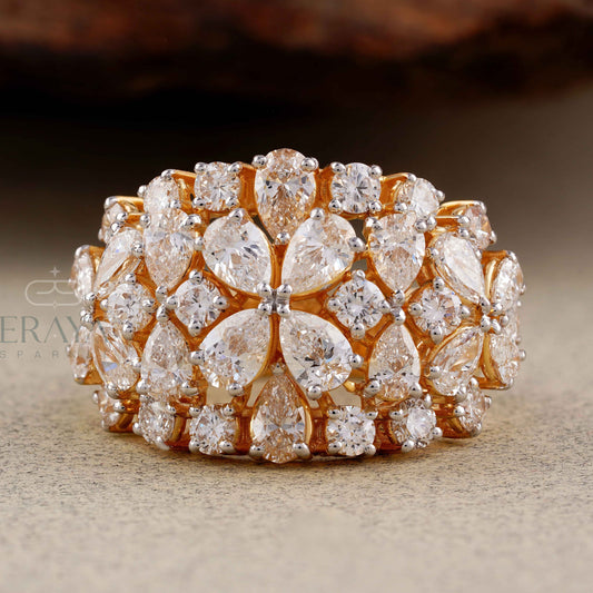 Gold ring with diamond accents on a textured surface