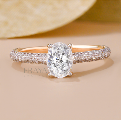 Rose gold oval solitaire ring with triple row diamond accents