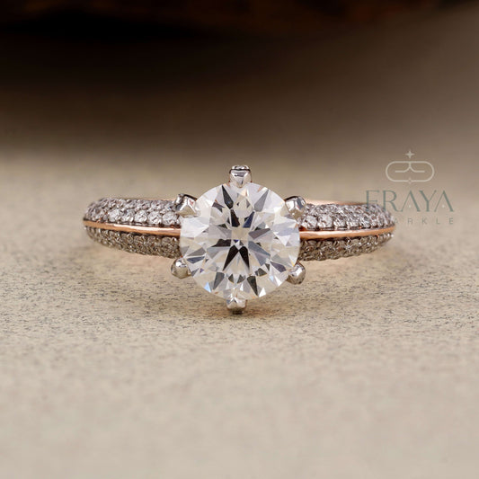 Diamond ring with rose gold band on a textured surface, featuring the brand 'Eraya'.