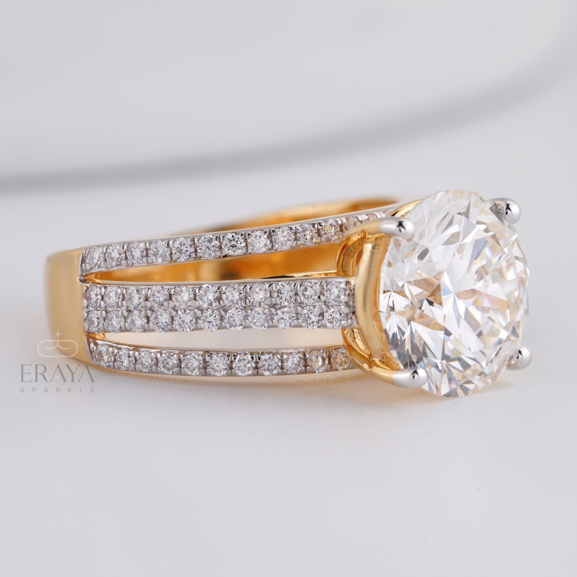 Yellow gold solitaire diamond ring with pavé band