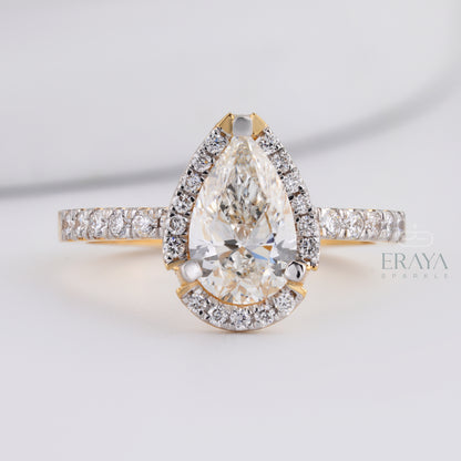side view pear cut engagement ring showing prong setting and band detail