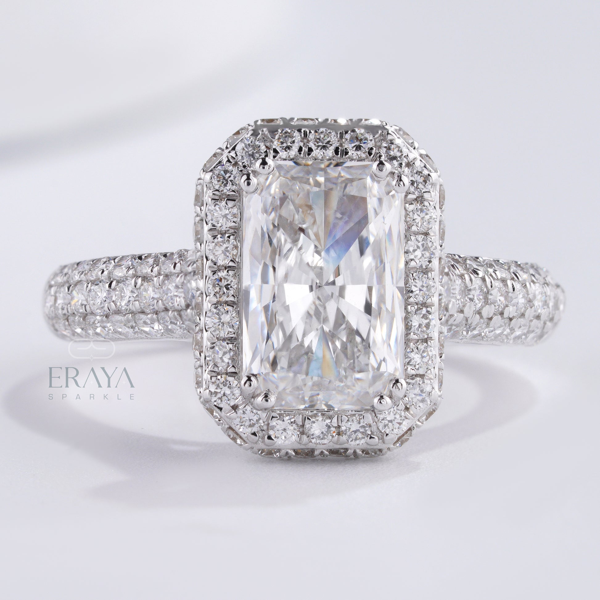 top view emerald-cut solitaire with triple-row pavé band