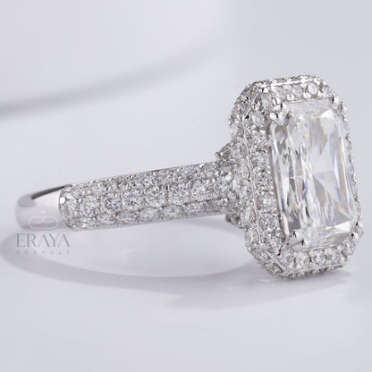 white gold emerald-cut engagement ring with sparkling side diamonds