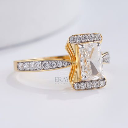 Gold ring with a large central gemstone and smaller diamonds on a light background