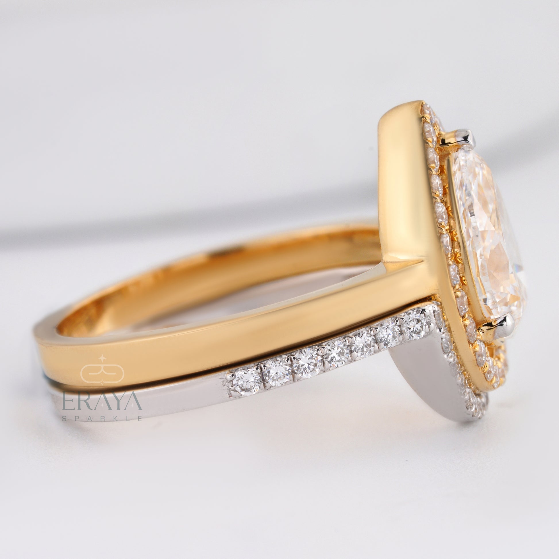 Close-up of pear cut halo ring featuring ethical lab-grown diamonds