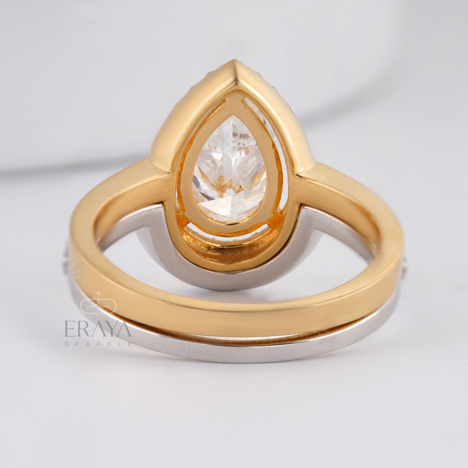 Pear shaped engagement ring set with sparkling side diamonds