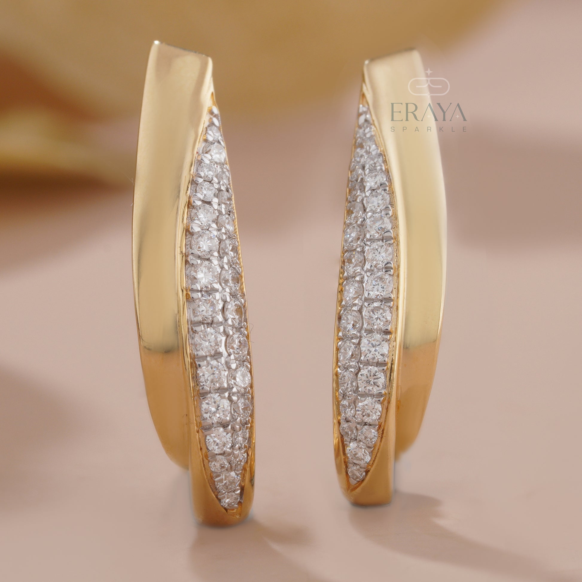 modern-curved-diamond-earrings-on-ear