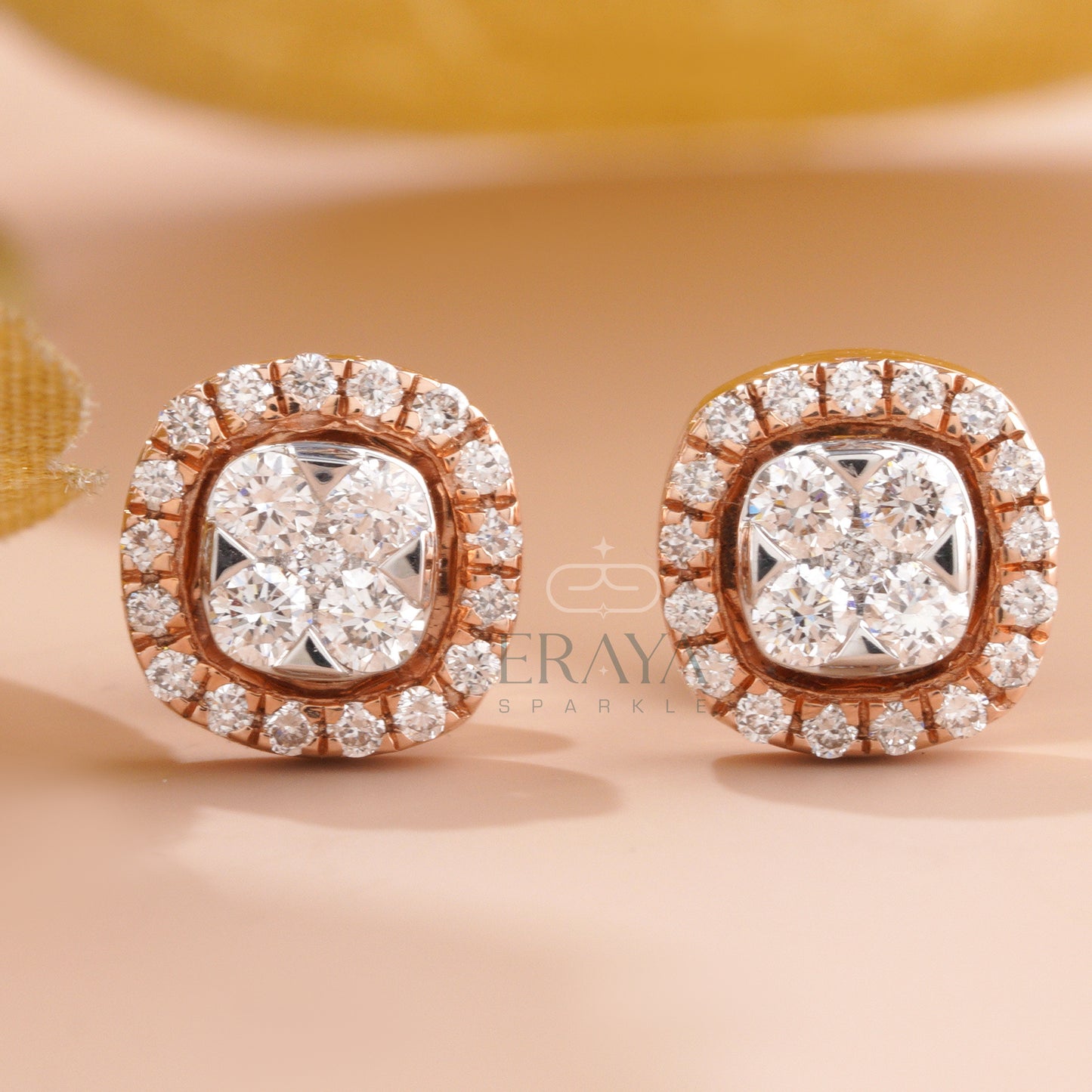 Close-up front view of round diamond cluster halo stud earring