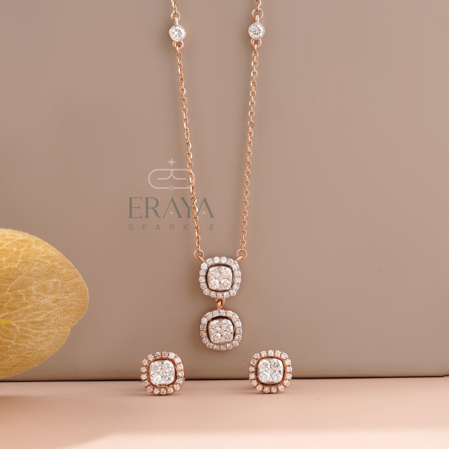 Front angle of round diamond halo pendant with matching halo stud earrings
