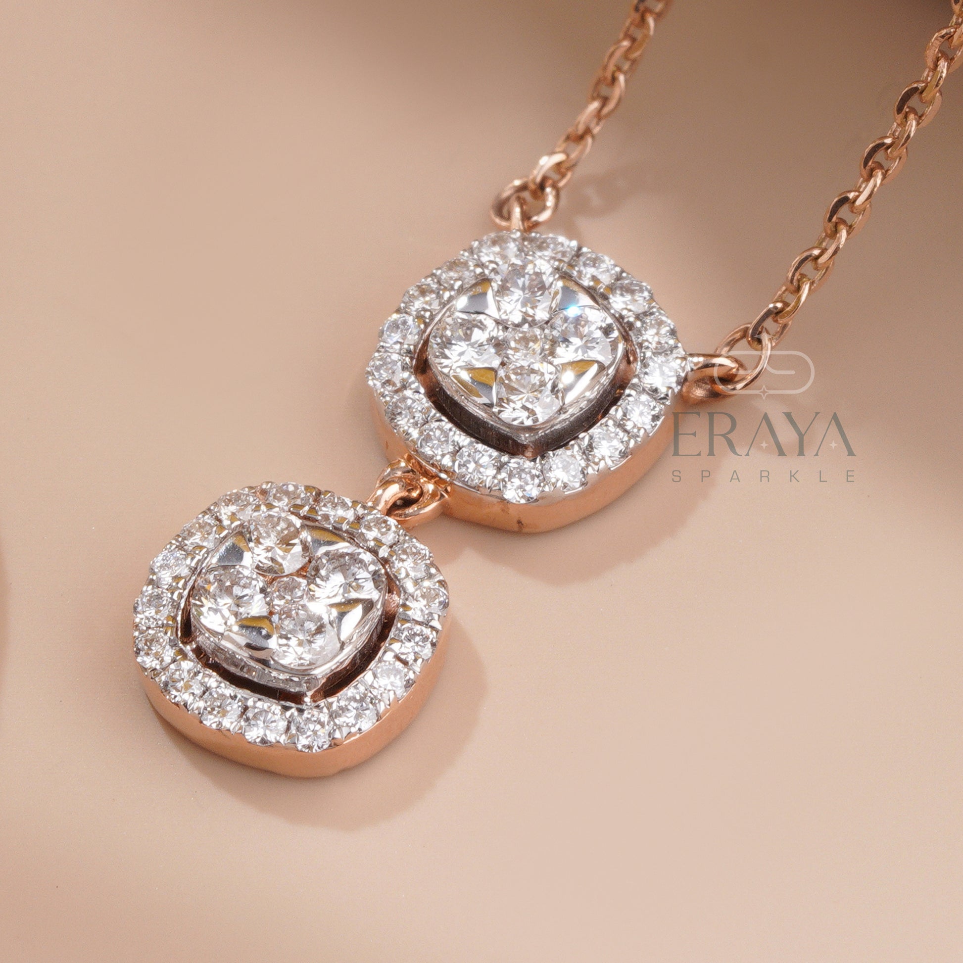 Side and cross-angle view of round diamond cluster pendant in rose gold