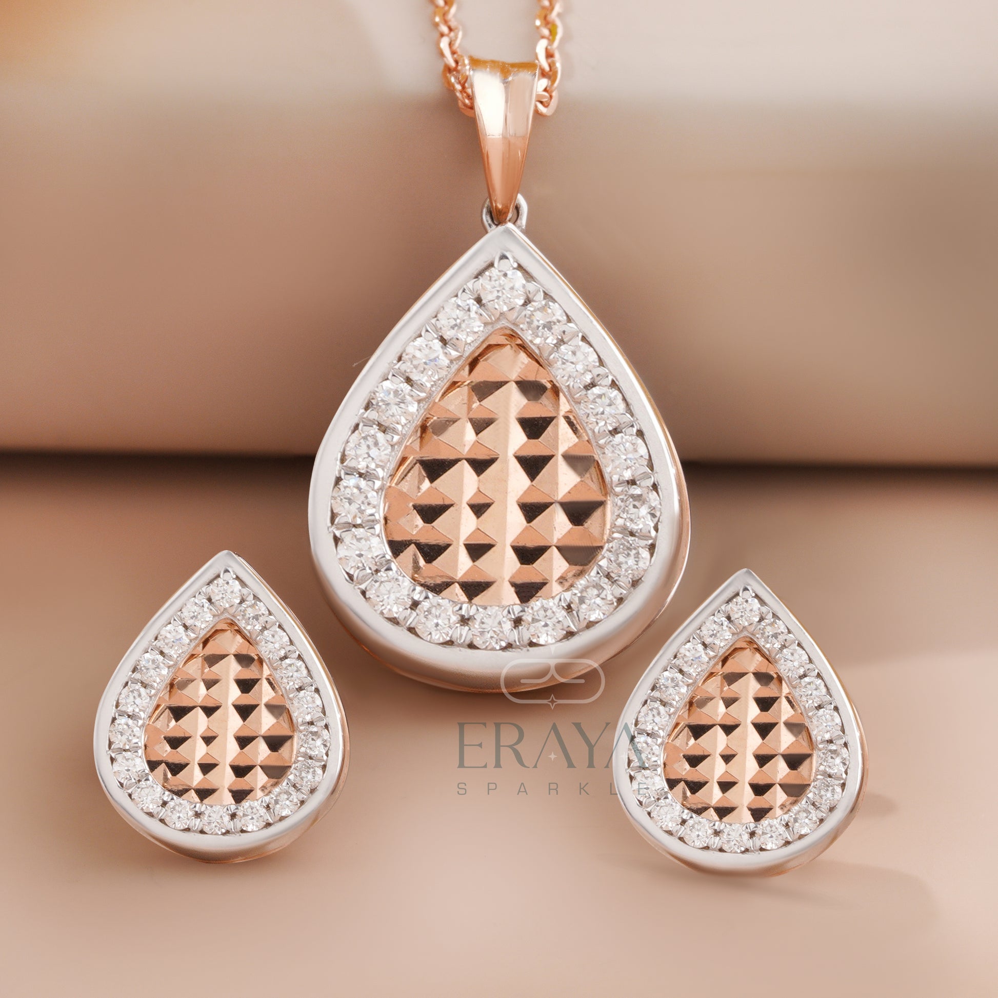 Teardrop diamond pendant and earrings set in rose gold – full front view