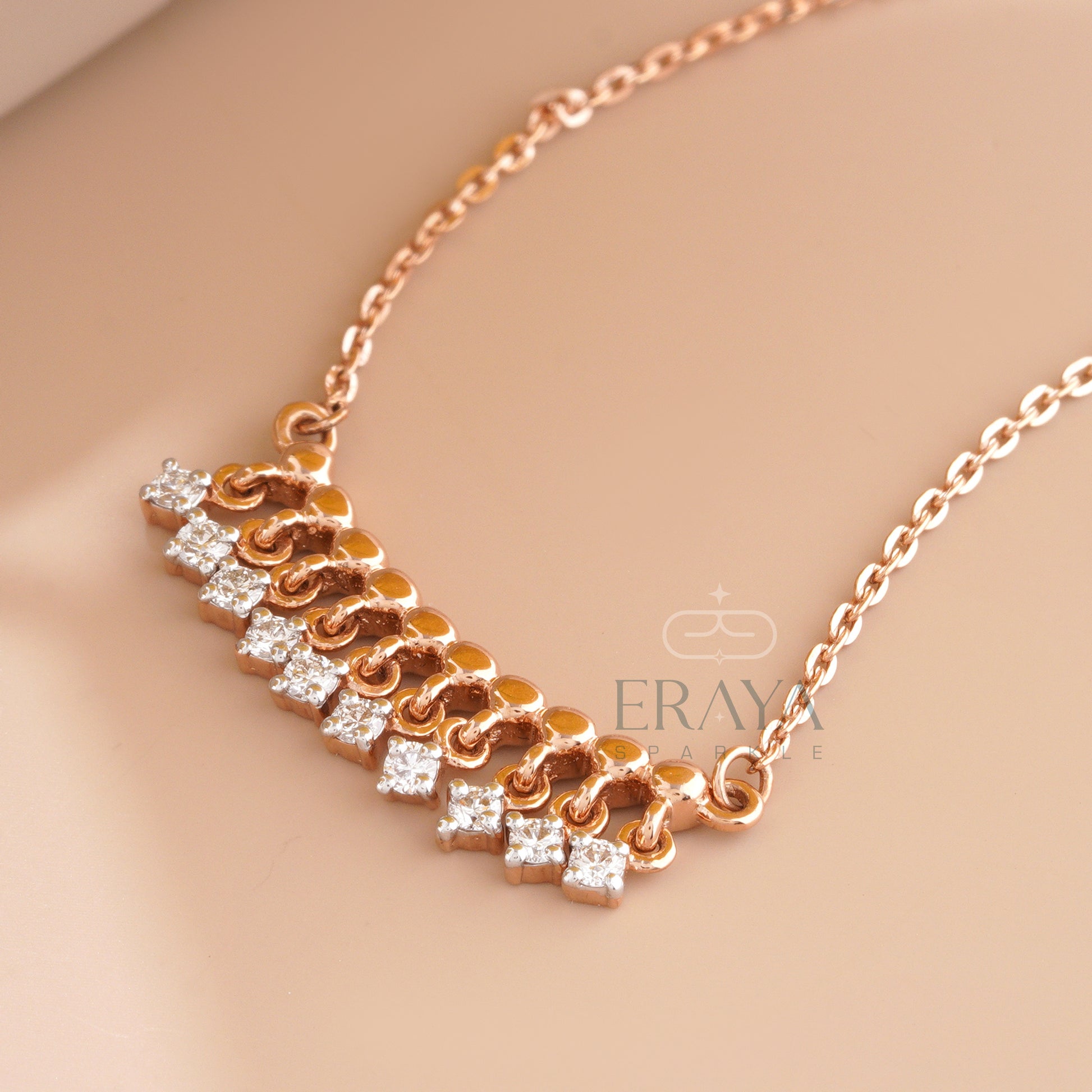 Dangling diamond bar necklace in rose gold with dangling lab-grown diamond charms