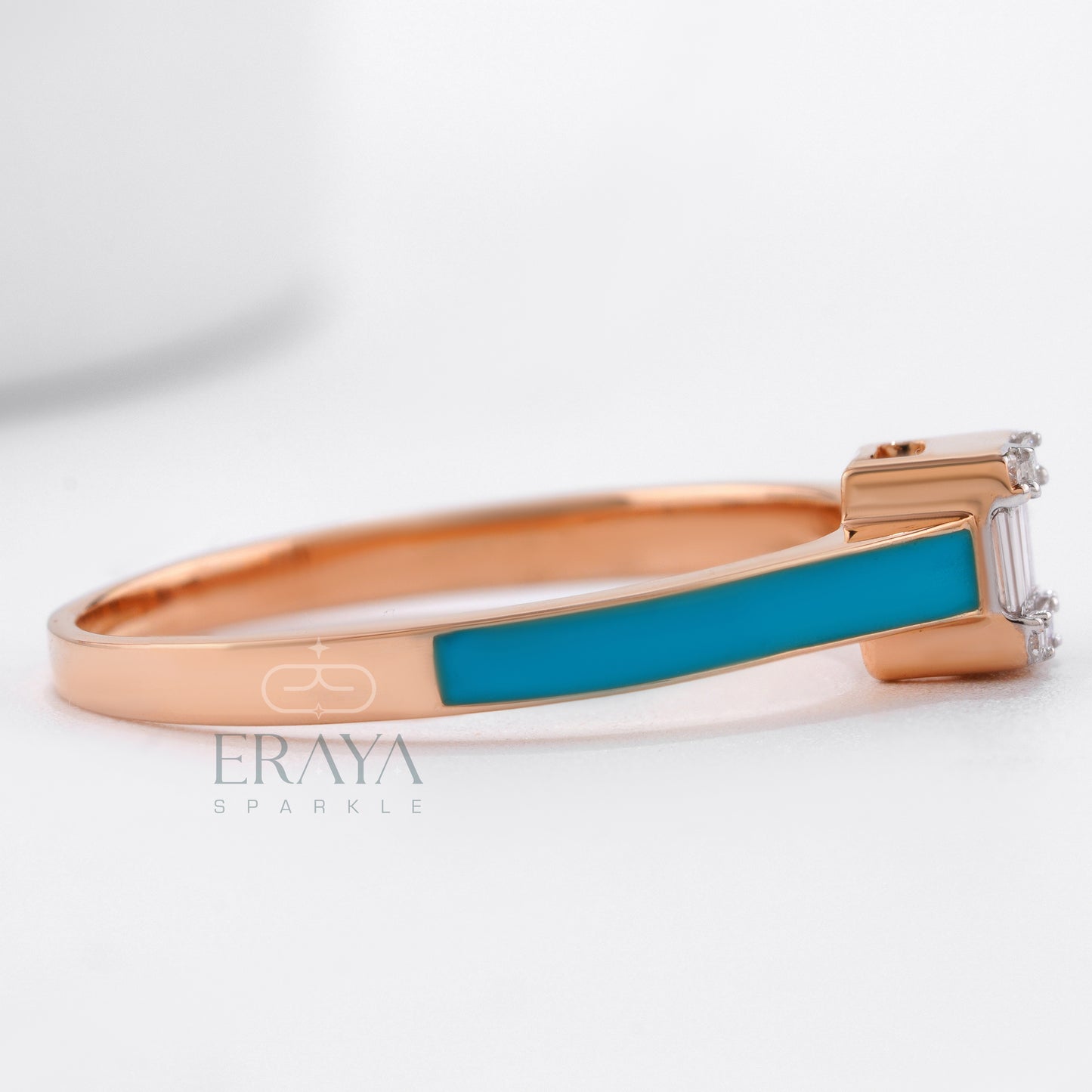 Styled shot: Eraya ring stacked with gold bands on hand.