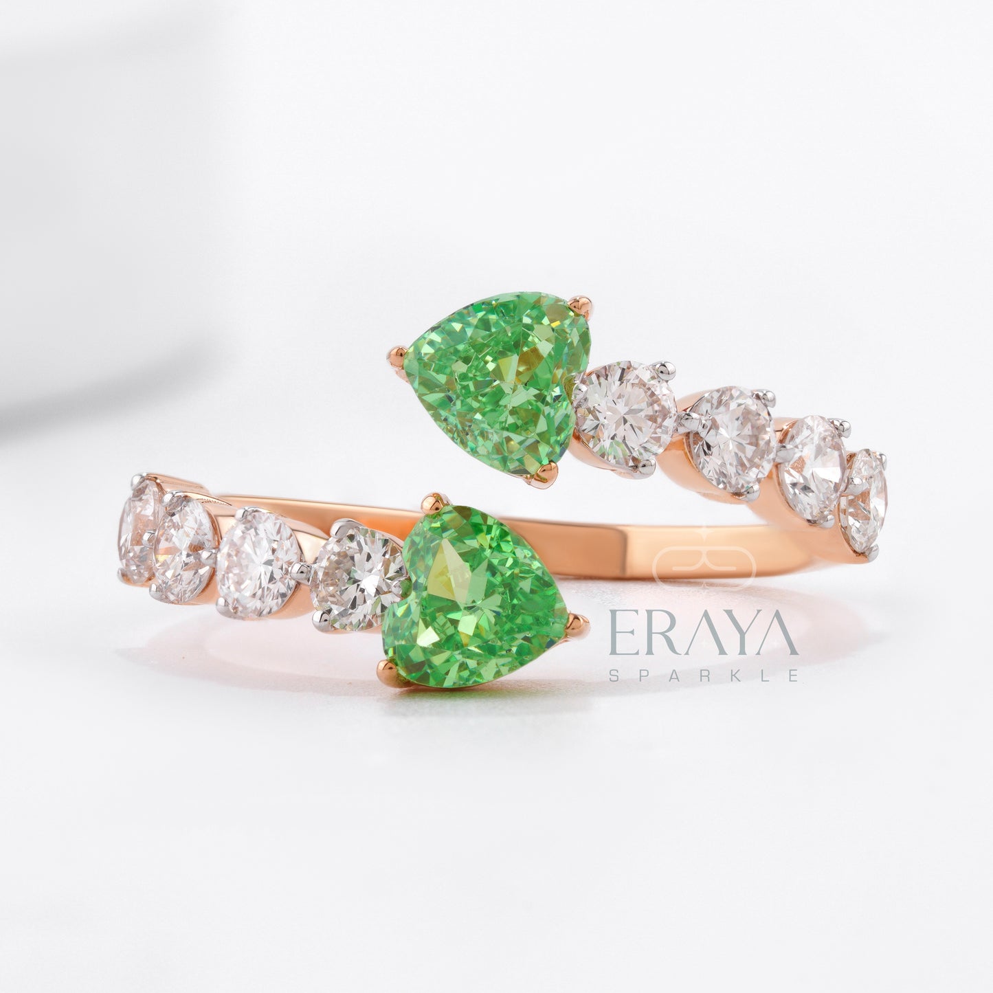 Adjustable rose gold heart-cut green stone ring close-up