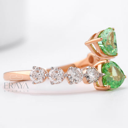 Rose gold ring with green gemstone and diamond accents on a white background, featuring the brand 'Eraya'.
