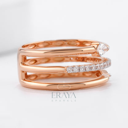 Rose gold ring with diamond accents on a light background, featuring the brand 'ERAYA'.