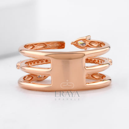 Rose gold bracelet with intricate designs on a light gray background, featuring the brand 'Eraya'.