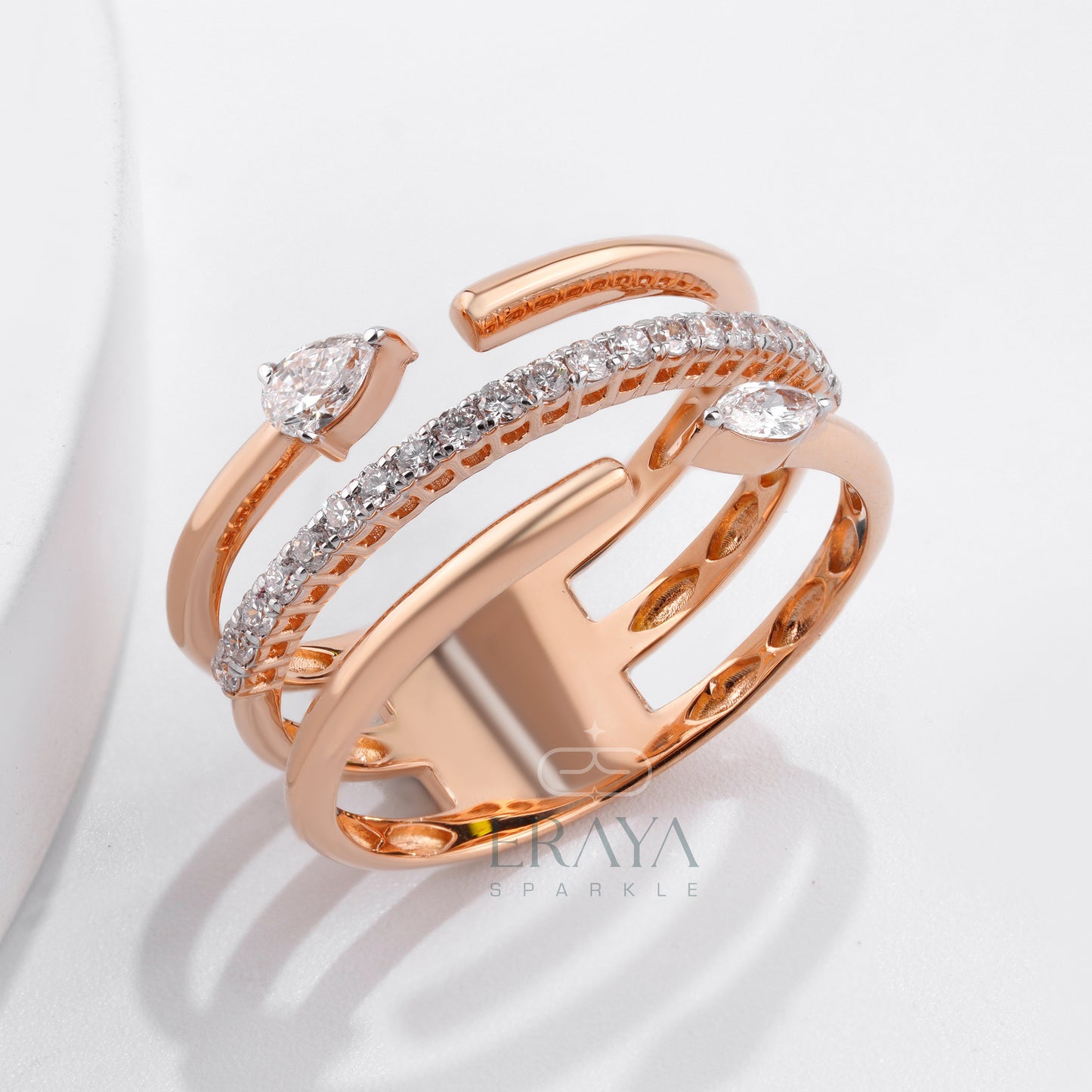 Sculptural rose gold statement ring with round side diamonds — detail shot