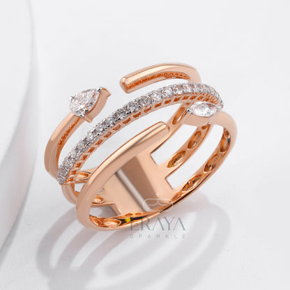Sculptural rose gold statement ring with round side diamonds — detail shot