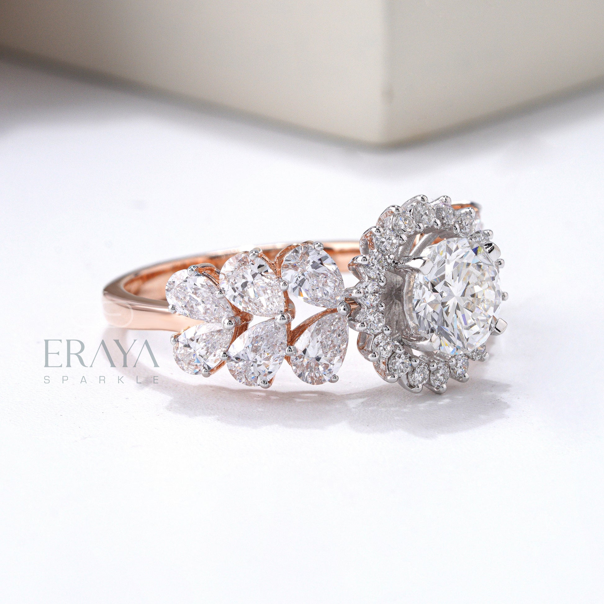 Rose gold diamond ring with pear side stones bridal jewelry