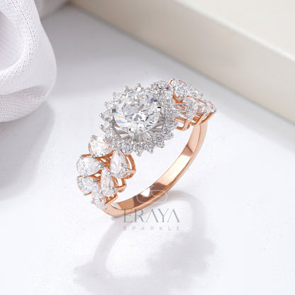 Solitaire diamond halo ring in rose gold with pear accents