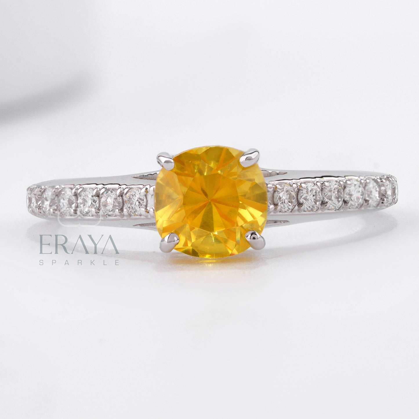 White gold engagement ring with vivid yellow cushion sapphire