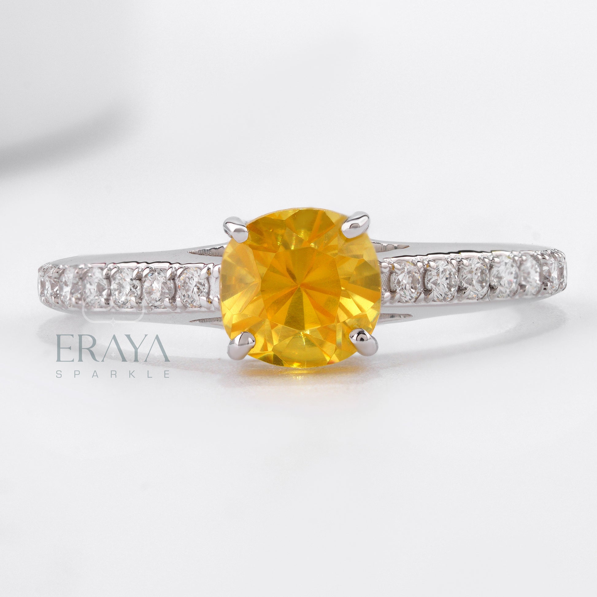 White gold engagement ring with vivid yellow cushion sapphire
