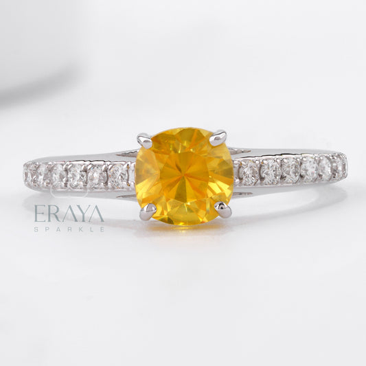 White gold engagement ring with vivid yellow cushion sapphire