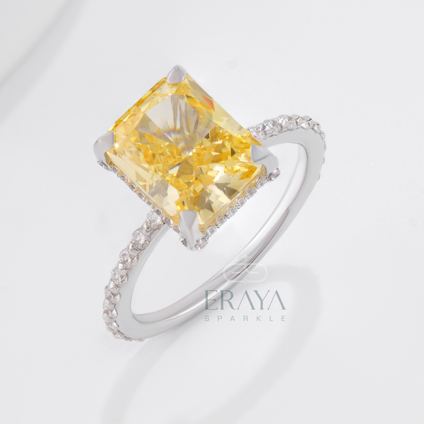 Radiant cut yellow sapphire engagement ring in white gold