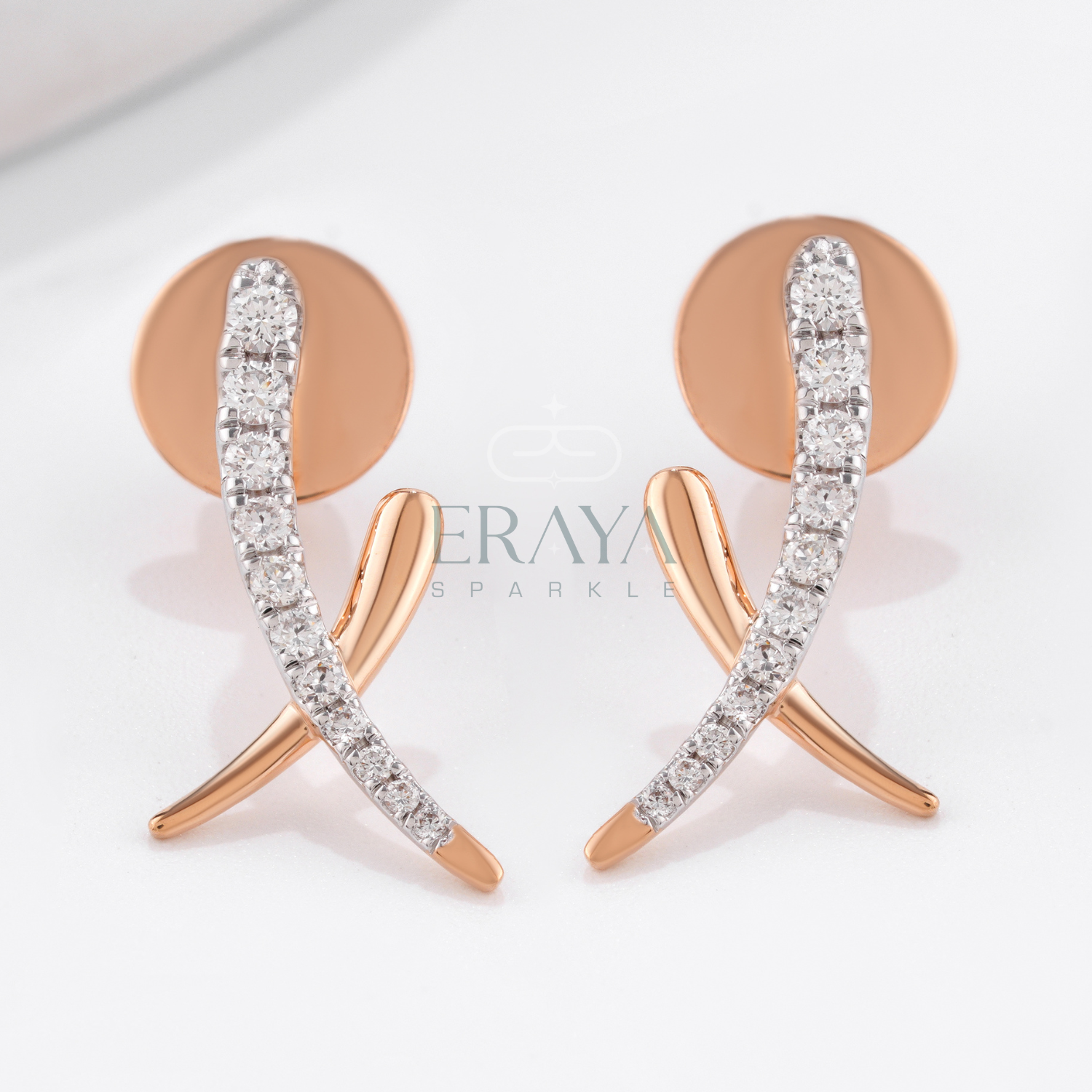 Rose gold earrings with clear gemstones on a light background, featuring the brand 'Eraya Sparkle'.
