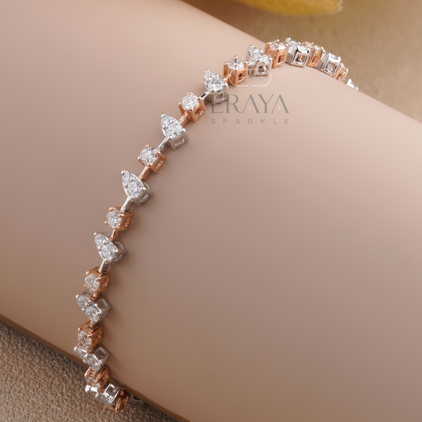 Close-up of pear-shaped settings with round lab grown diamonds