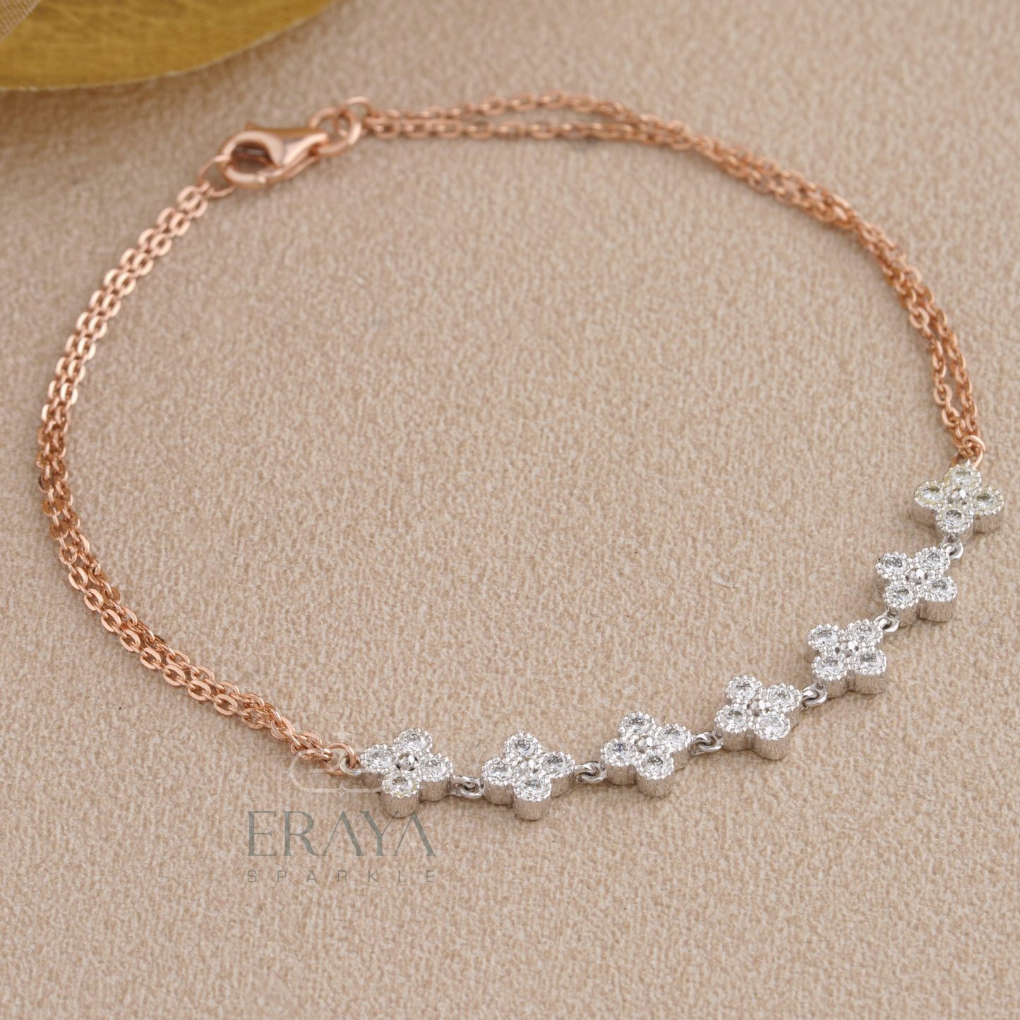 Close-up of lab grown diamonds floral cluster on rose gold bracelet