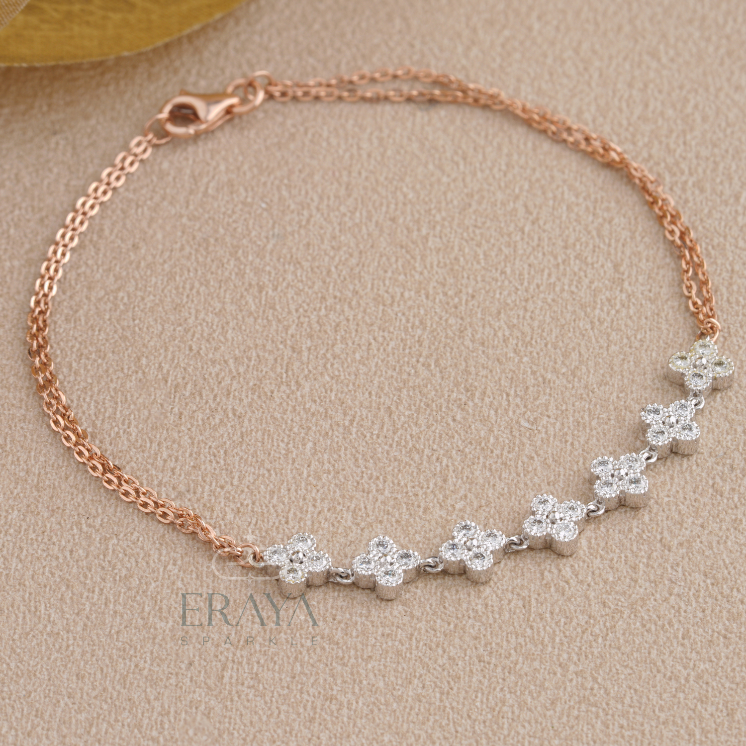 Close-up of lab grown diamonds floral cluster on rose gold bracelet