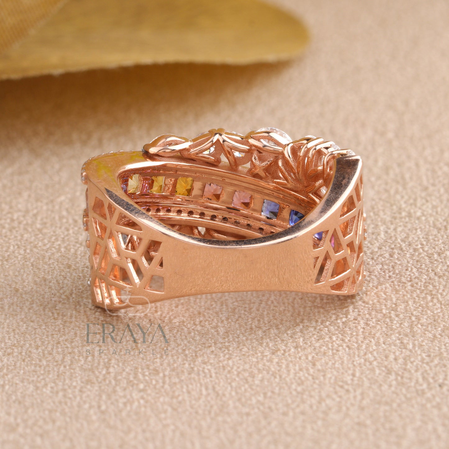 Bottom view of the rainbow princess-cut ring showing band structure and clean gold finish.